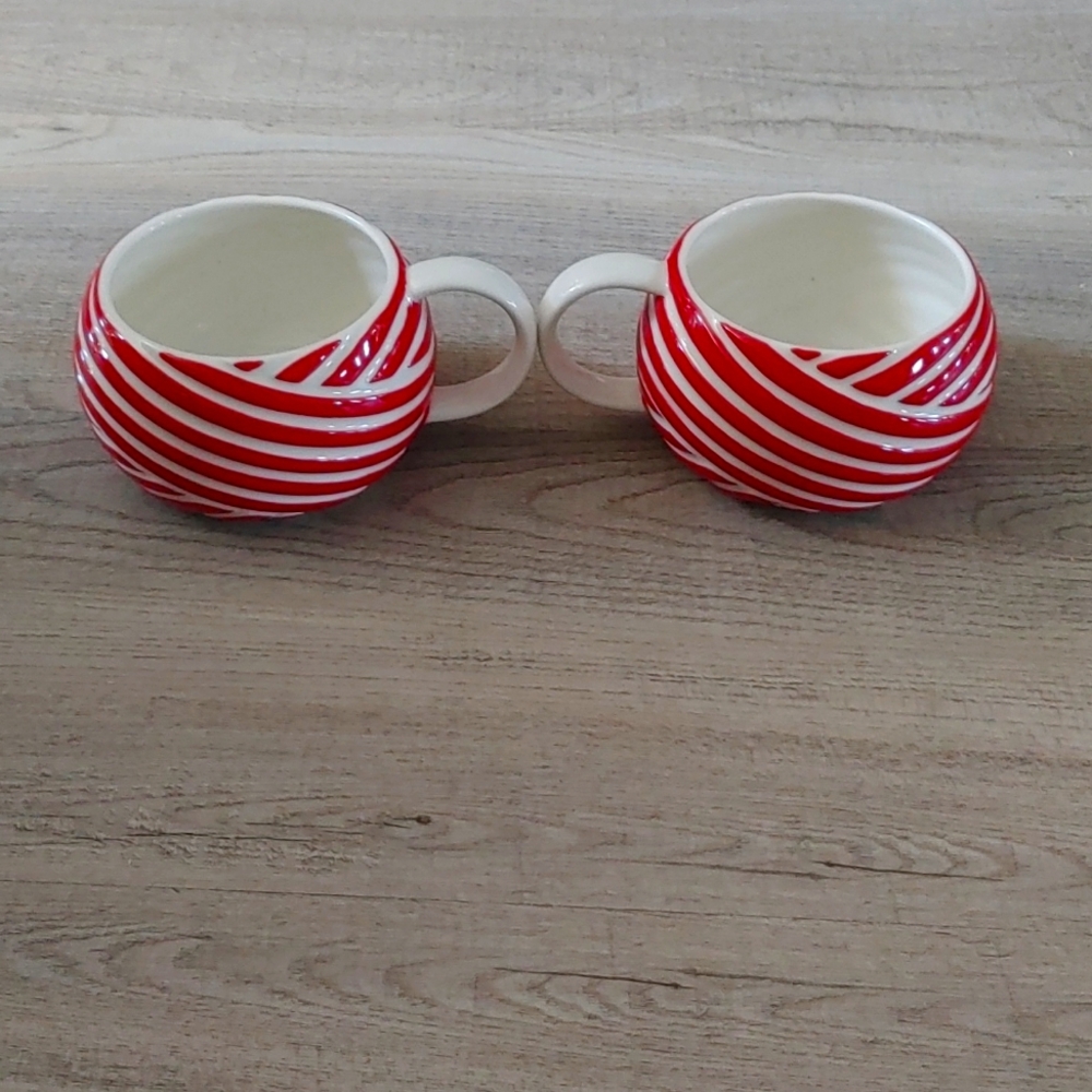 Two holiday themed starbuck mugs